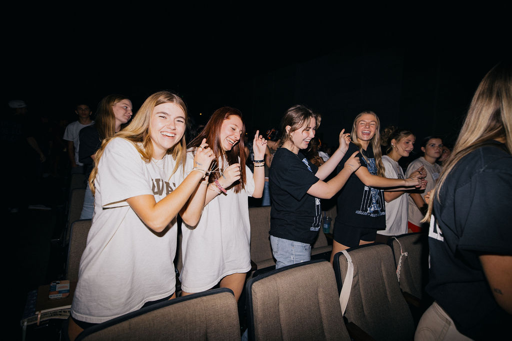 Students laughing together at an Elevate Wednesday night